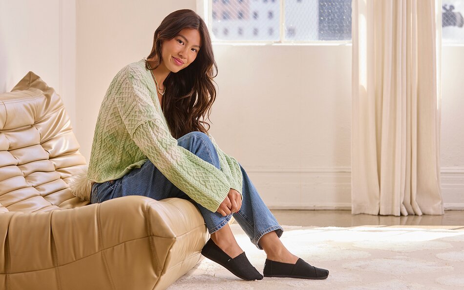 Model wearing Alpargata in all black heritage canvas shown.