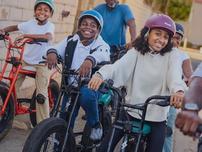 A group kids riding bikes.
